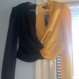 Black and Gold slightly cropped blouse.